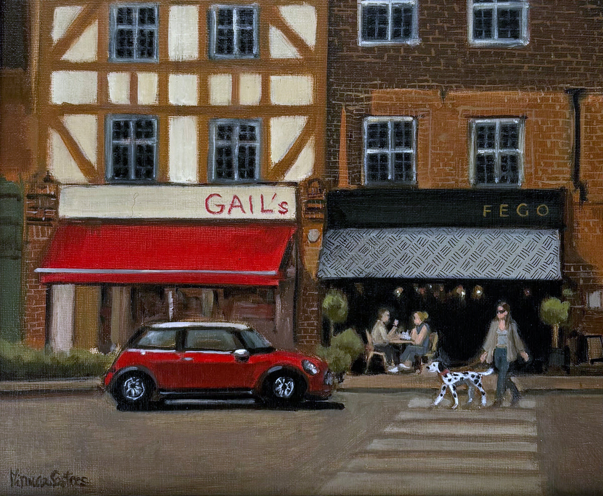 Original oil painting of Esher, Surrey, by Minuca Sostres, featuring Gail's Bakery, Fego café, a classic red Mini Cooper and a morning village street scene.