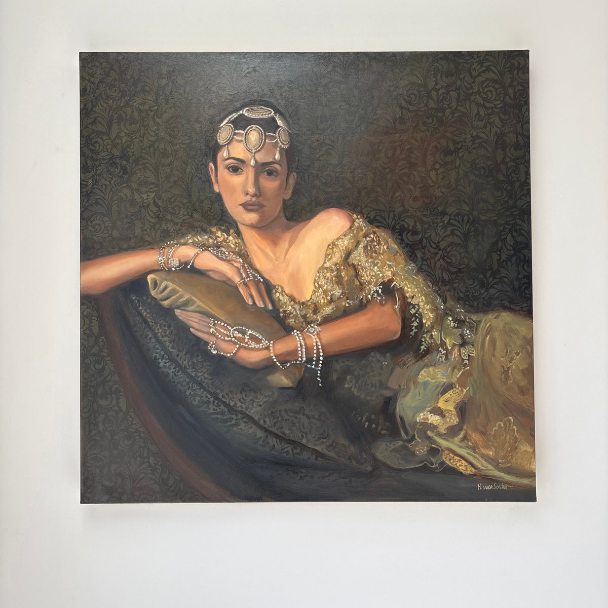 Portrait of a woman in elaborate clothing and jewelry against a dark background